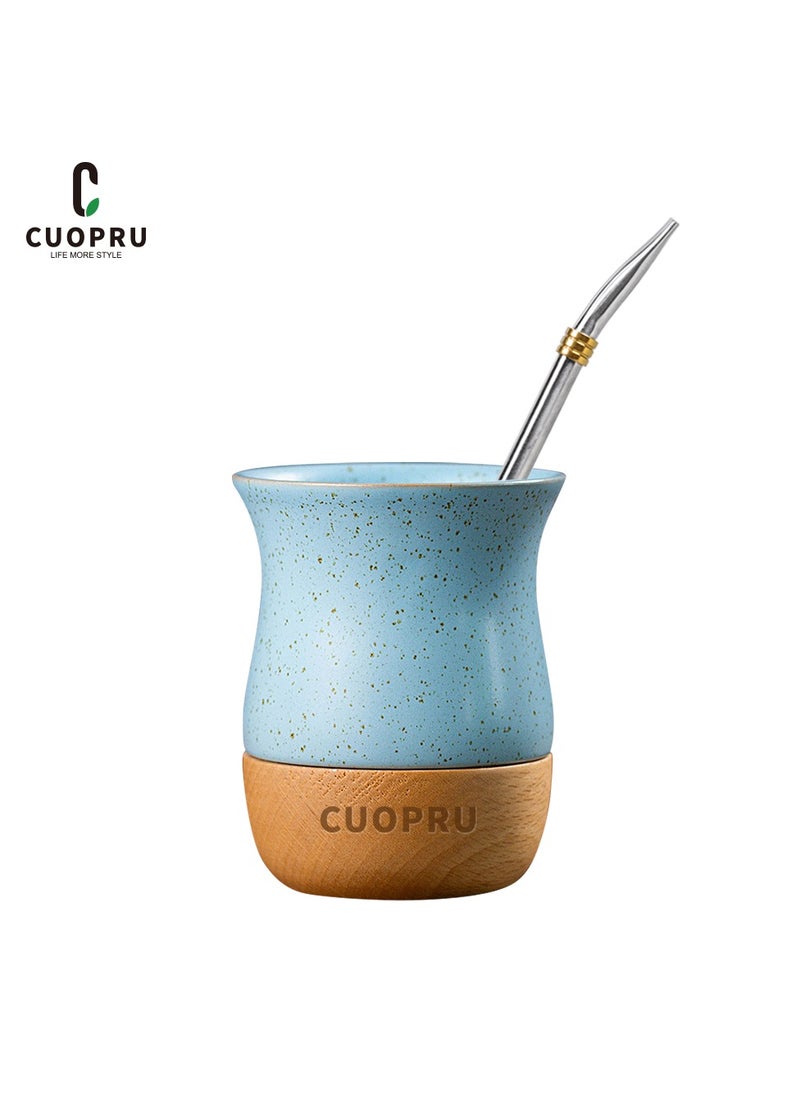 Ceramic cup on wooden base with straw brush, mate tea cup, coffee cup