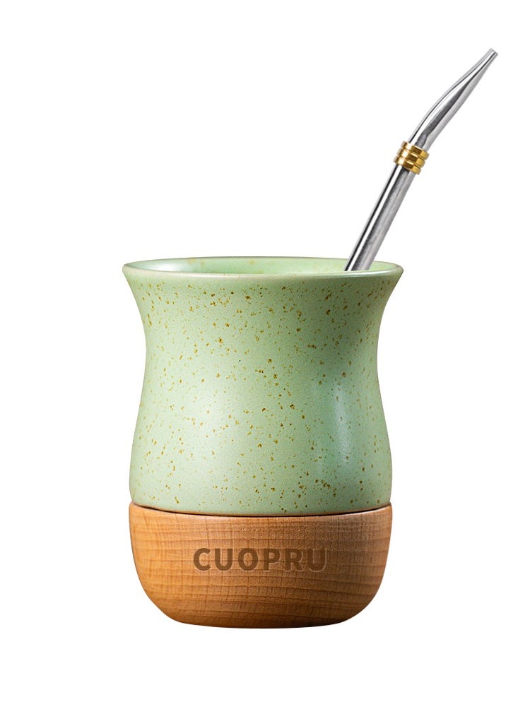 Ceramic cup on wooden base with straw brush, mate tea cup, coffee cup