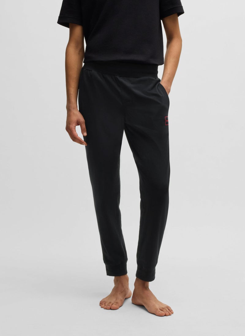 Stretch-cotton tracksuit bottoms with logo print