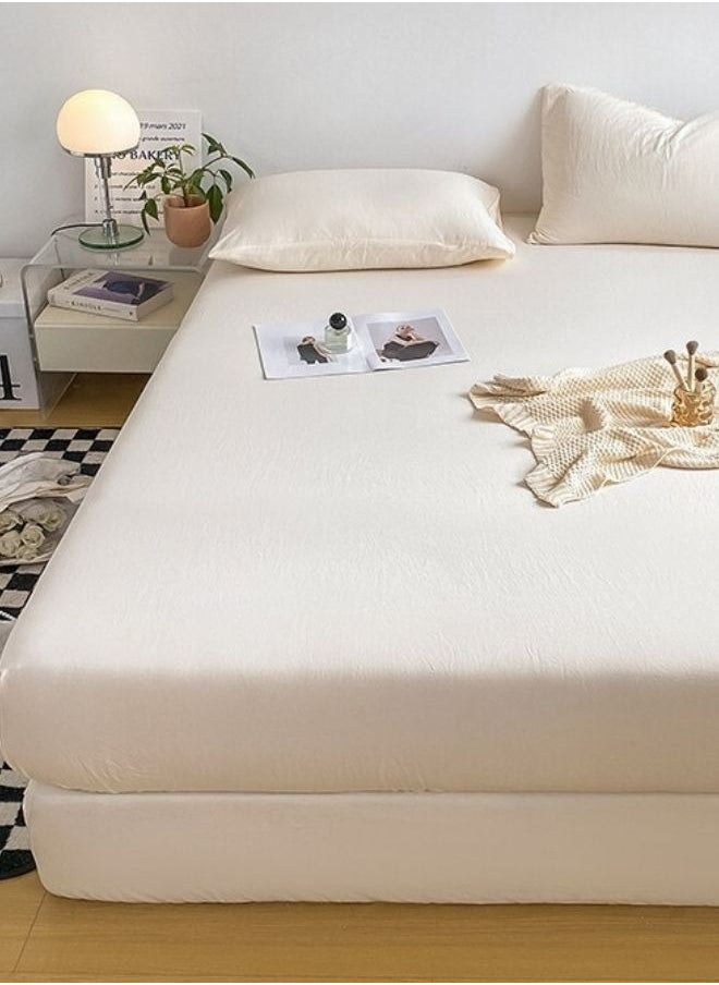 3-Piece Set: queen-size fitted bedsheet and two pillowcases, washable cotton in a milky white color.