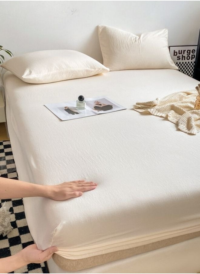 3-Piece Set: queen-size fitted bedsheet and two pillowcases, washable cotton in a milky white color.