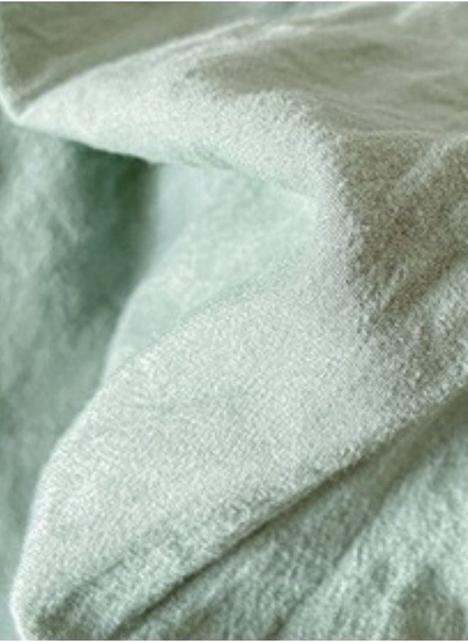 3-Piece Set: Includes a king-size fitted bedsheet and two pillowcases, washable cotton in a light green color.