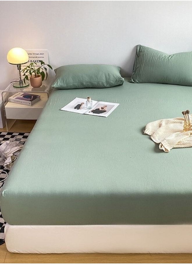 3-Piece Set: Includes a king-size fitted bedsheet and two pillowcases, washable cotton in a light green color.