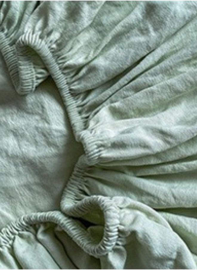 3-Piece Set: Includes a king-size fitted bedsheet and two pillowcases, washable cotton in a light green color.