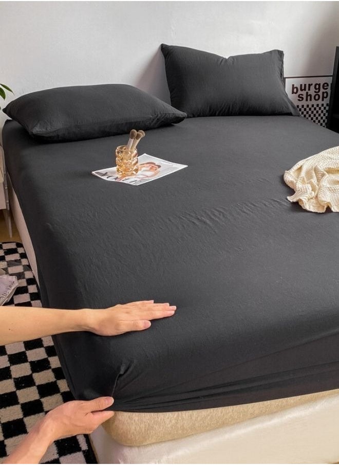 3-Piece Set: queen-size fitted bedsheet and two pillowcases, washable cotton in a black color.