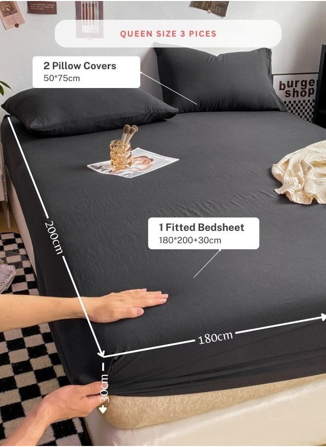 3-Piece Set: queen-size fitted bedsheet and two pillowcases, washable cotton in a black color.