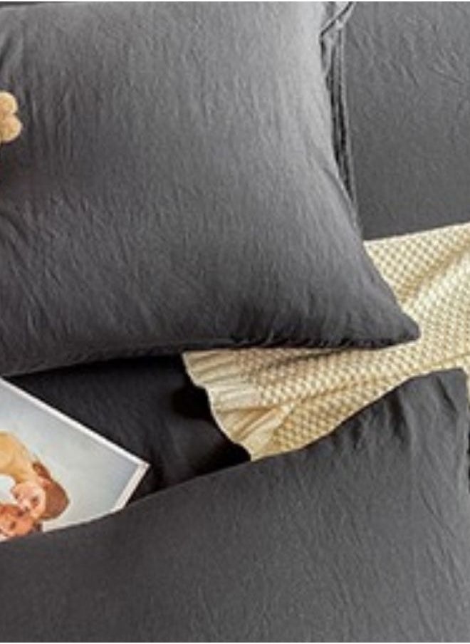 3-Piece Set: queen-size fitted bedsheet and two pillowcases, washable cotton in a black color.