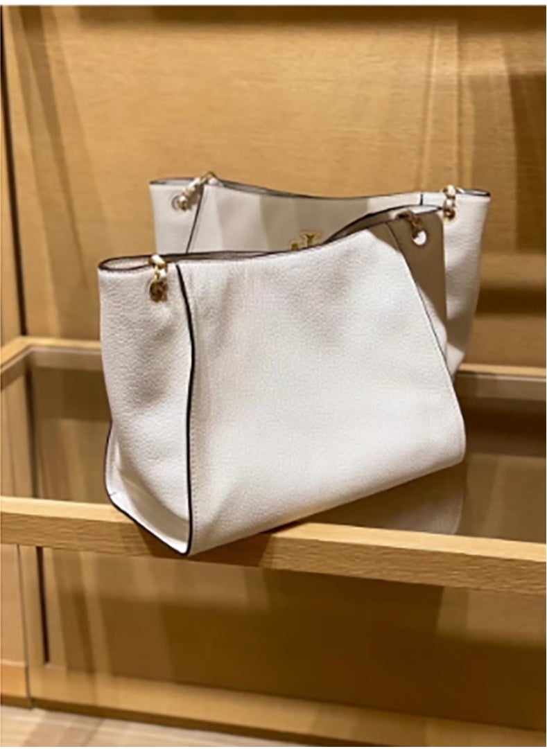 A large - capacity tote from Tory Burch's Britten series, made of cowhide. It features a simple yet fashionable design and can be carried either as a handbag or a shoulder bag, which is great for commuters.