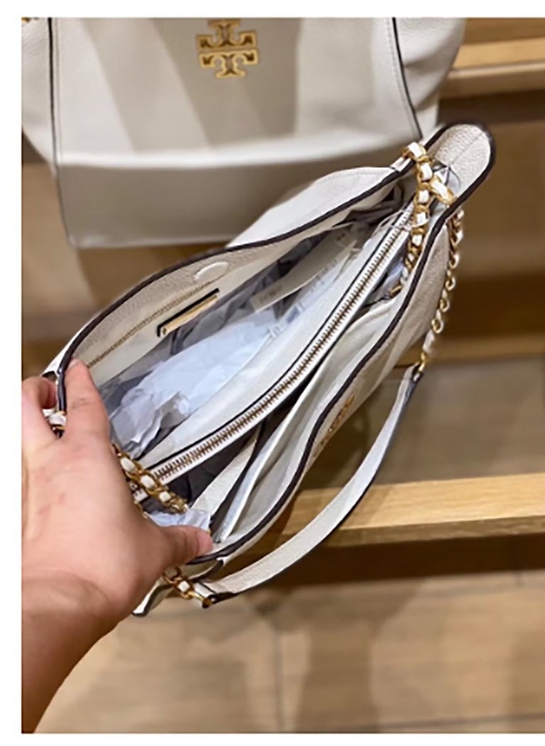 A large - capacity tote from Tory Burch's Britten series, made of cowhide. It features a simple yet fashionable design and can be carried either as a handbag or a shoulder bag, which is great for commuters.