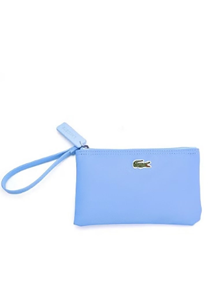 A small, solid - colored zipper wallet by Lacoste