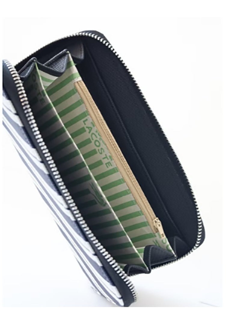 A spacious purse featuring a zip - around design