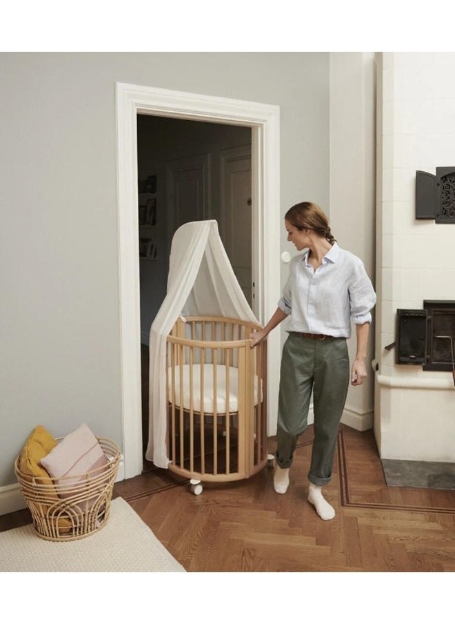 Sleepi Mini Oval Baby Crib 0-6 Months Height-Adjustable Base, Lockable Swivel Wheels White