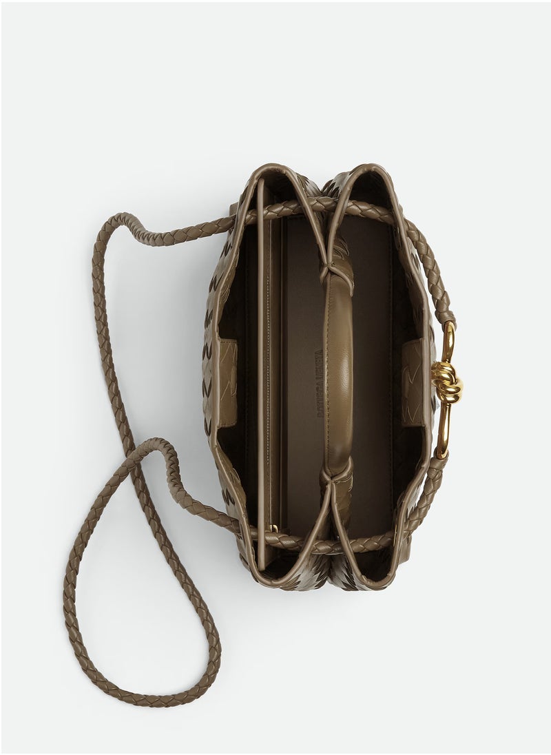 VENETA Andiamo Top handle bag leather bag with signature knot detail and sliding cross-body strap.