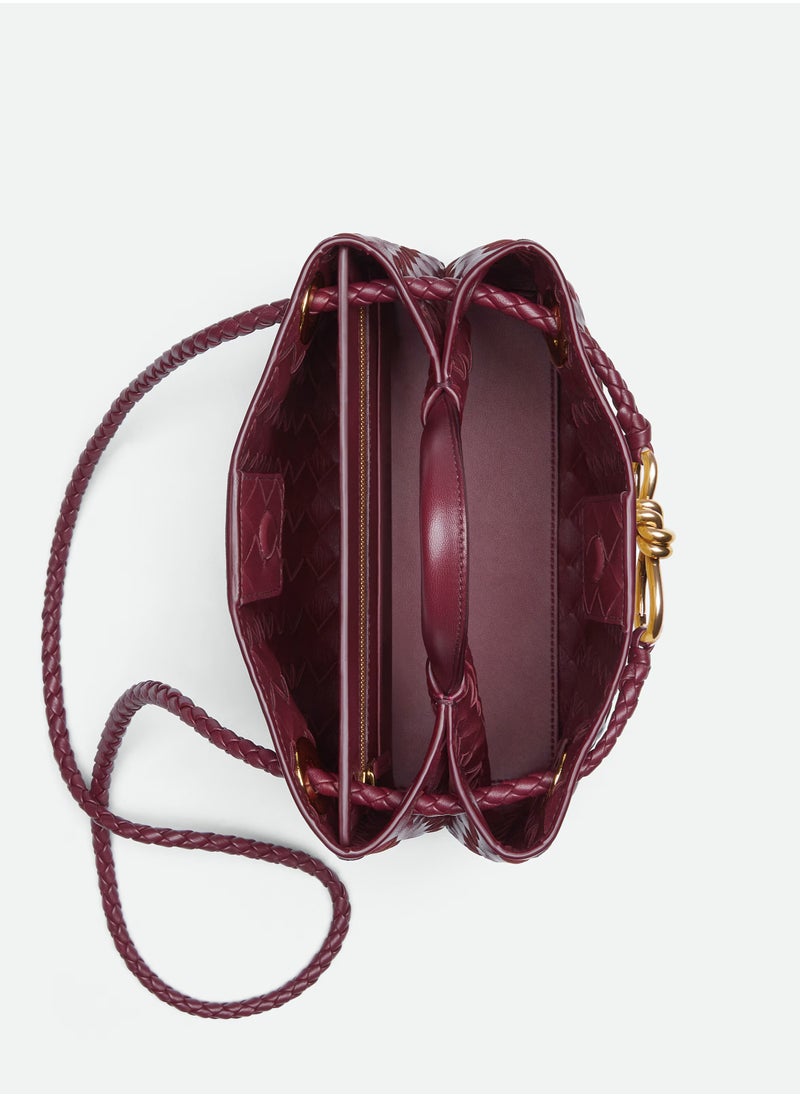 VENETA Andiamo Top handle bag leather bag with signature knot detail and sliding cross-body strap.