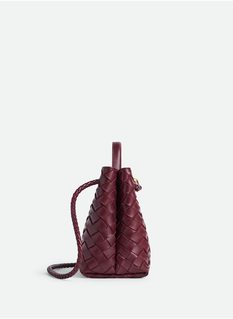 VENETA Andiamo Top handle bag leather bag with signature knot detail and sliding cross-body strap.