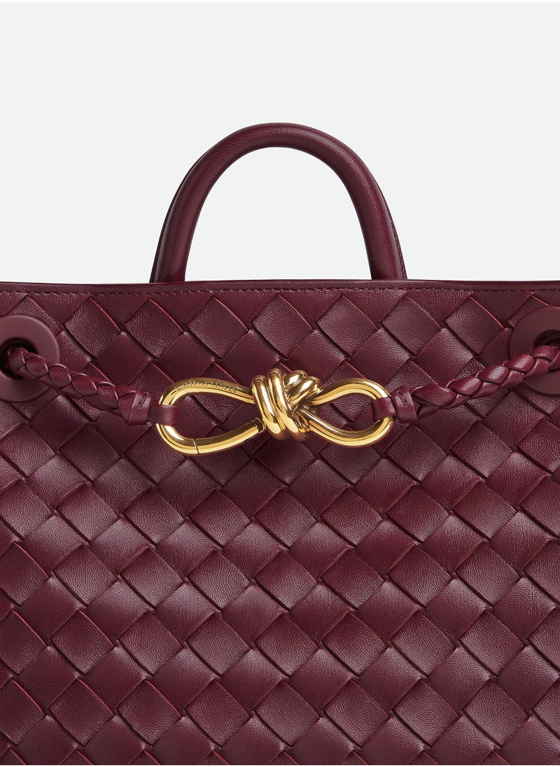 VENETA Andiamo Top handle bag leather bag with signature knot detail and sliding cross-body strap.