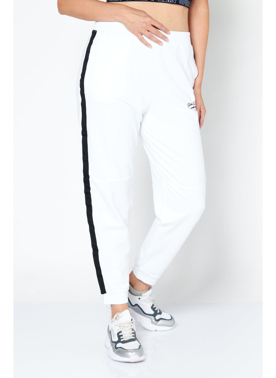 Women Sportswear Fit Brand Logo Training Pants, White/Black