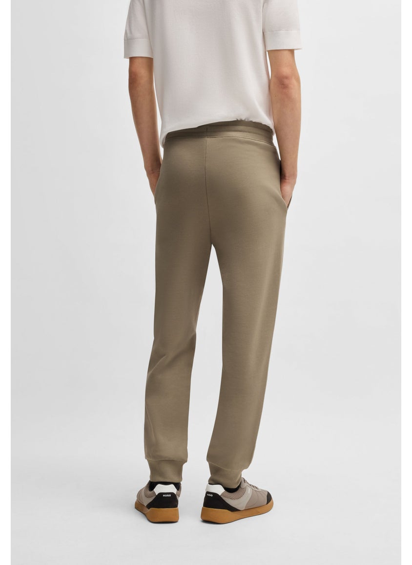 Cotton-terry tracksuit bottoms with logo print