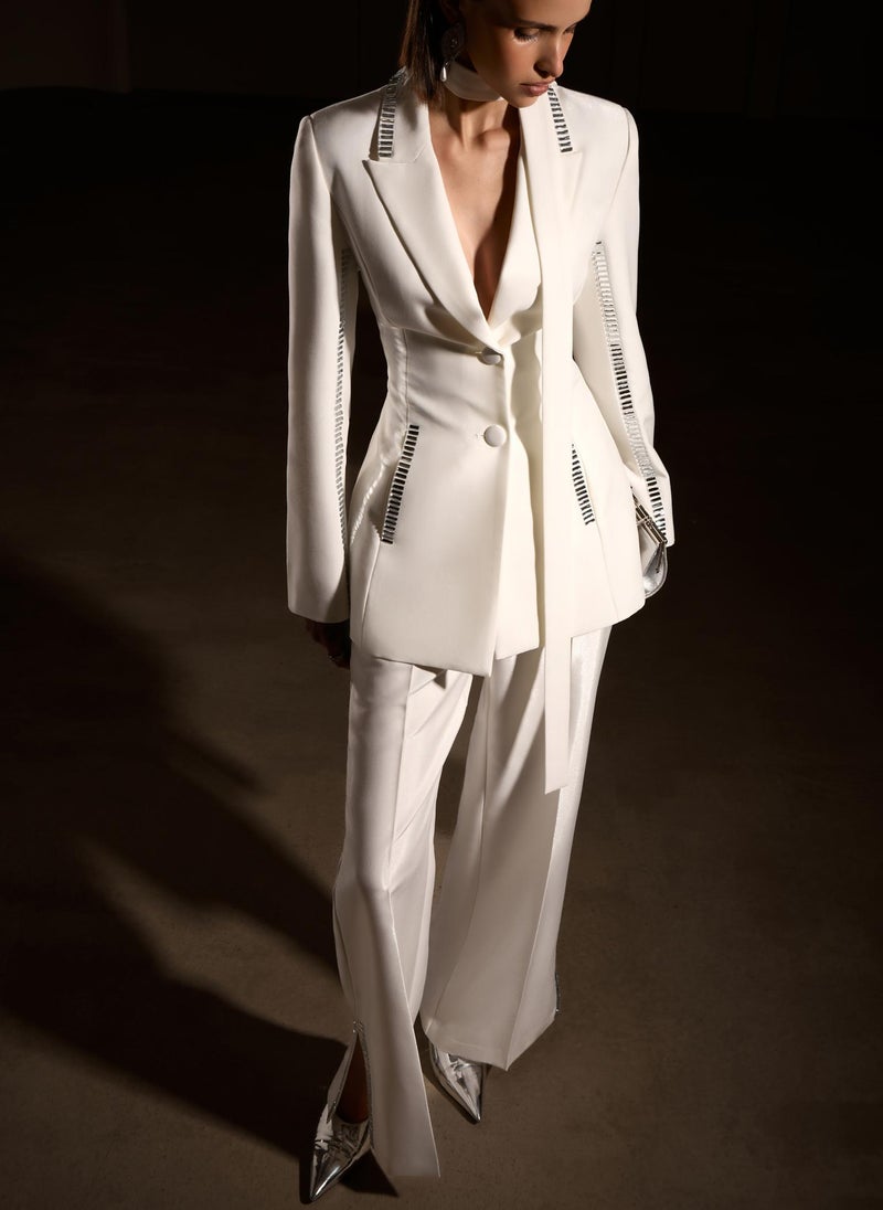 Trousers with slits on the pant legs and silvertone decor