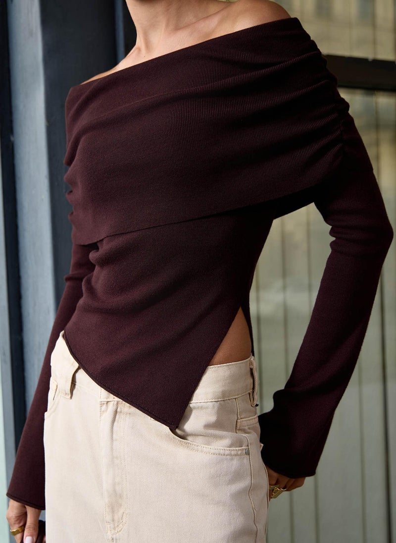 Knitted jumper with open shoulder line