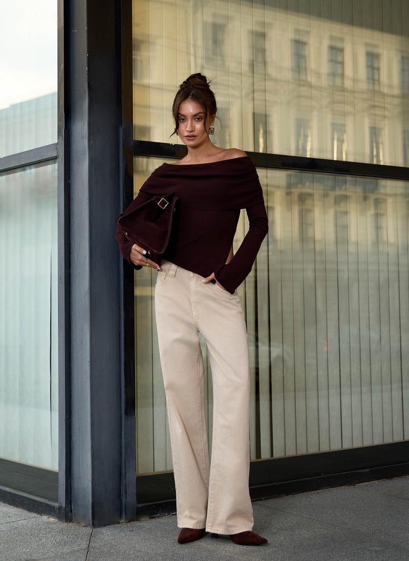 Knitted jumper with open shoulder line