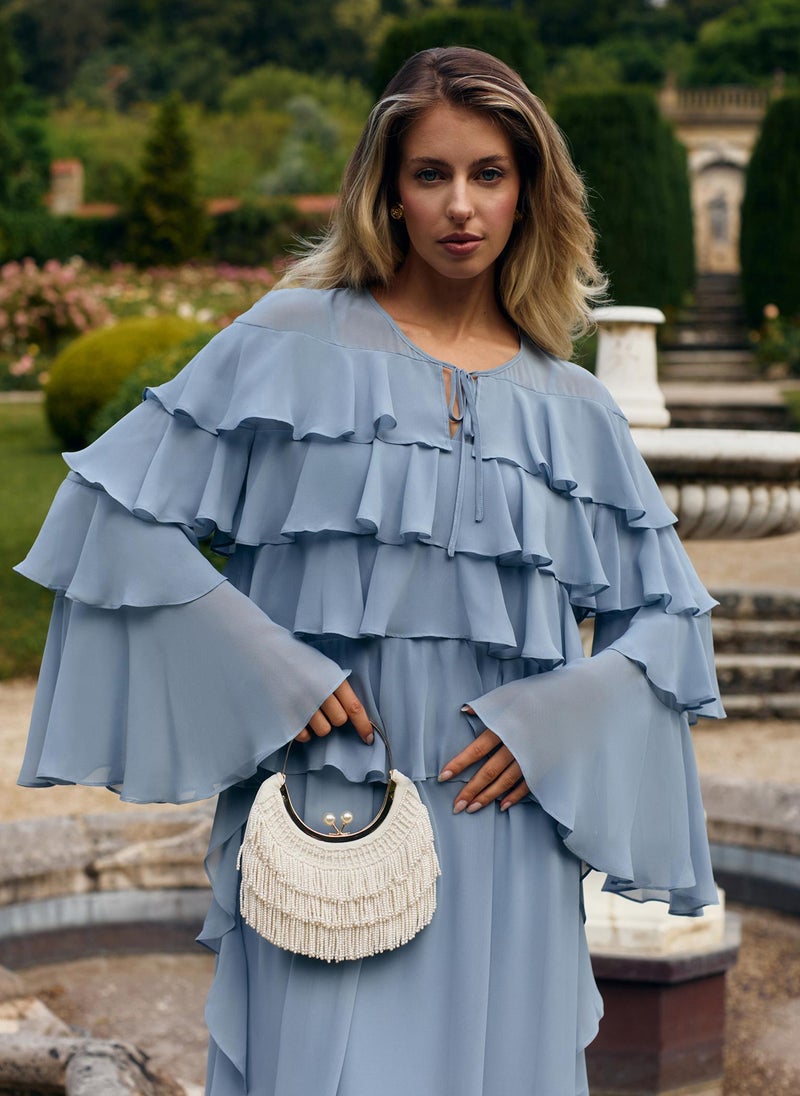 Airy maxi dress with ruffles on the bodice and matching ties