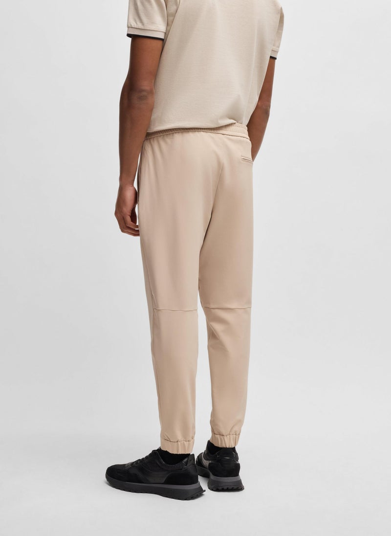 Tapered-fit trousers in water-repellent stretch fabric