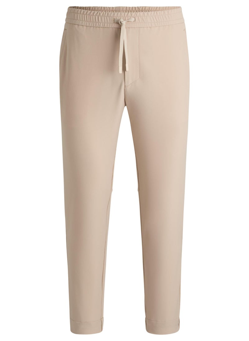 Tapered-fit trousers in water-repellent stretch fabric