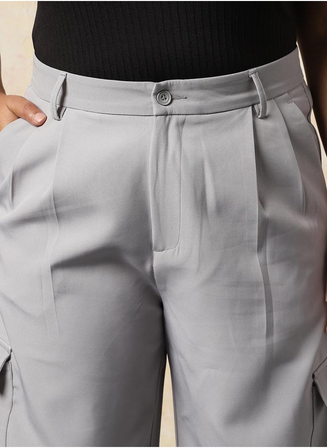 Women Trousers in Grey featuring Wide Leg fit with a solid pattern, regular length, secured with button closure, crafted from 95% polyester 5% spandex – a stylish must-have for any occasion.
