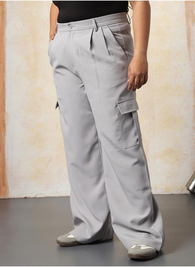 Women Trousers in Grey featuring Wide Leg fit with a solid pattern, regular length, secured with button closure, crafted from 95% polyester 5% spandex – a stylish must-have for any occasion.