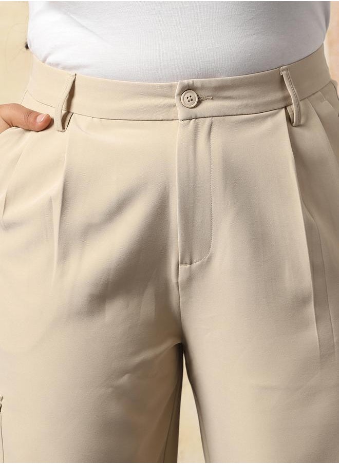 Women Trousers in Beige featuring Wide Leg fit with a solid pattern, regular length, secured with button closure, crafted from 95% polyester 5% spandex – crafted for those who appreciate style and comfort.