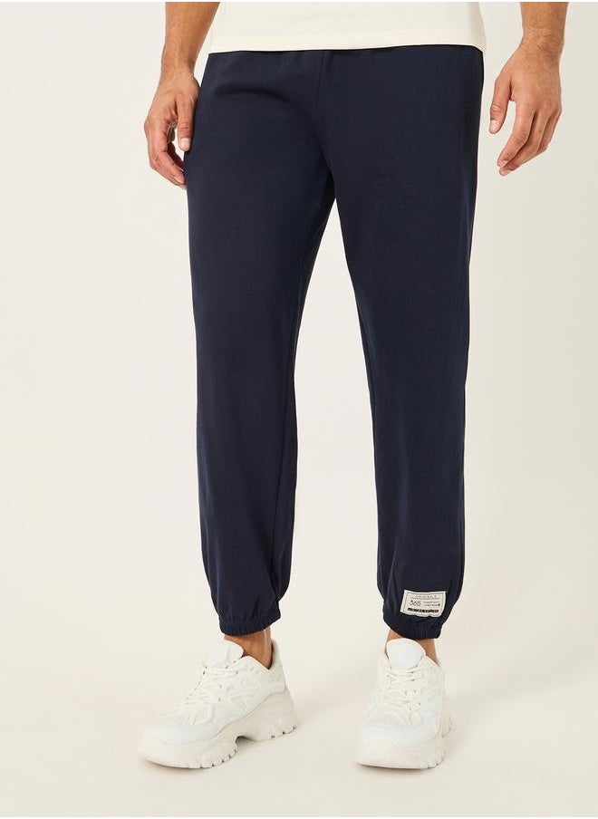 Relaxed Fit Fleece Badge Detail Joggers with Zip Pockets
