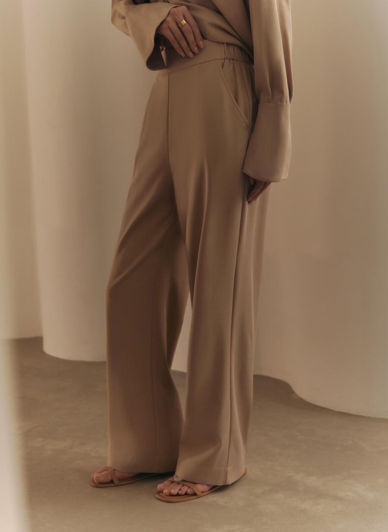 Straight trousers with elasticated waistband