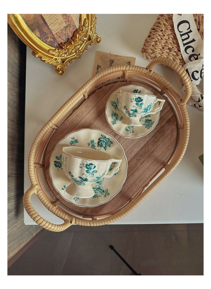 Coffee cup with saucer decorated with elegant flowers made of ceramic