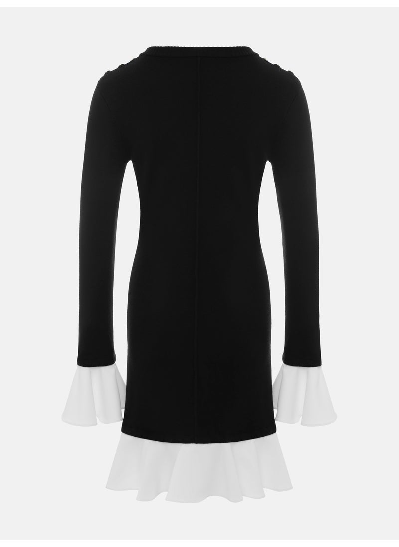 Mini knitted dress with contrasting flounces on the cuffs and skirt