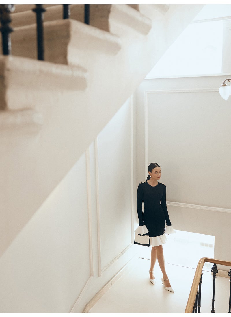 Mini knitted dress with contrasting flounces on the cuffs and skirt