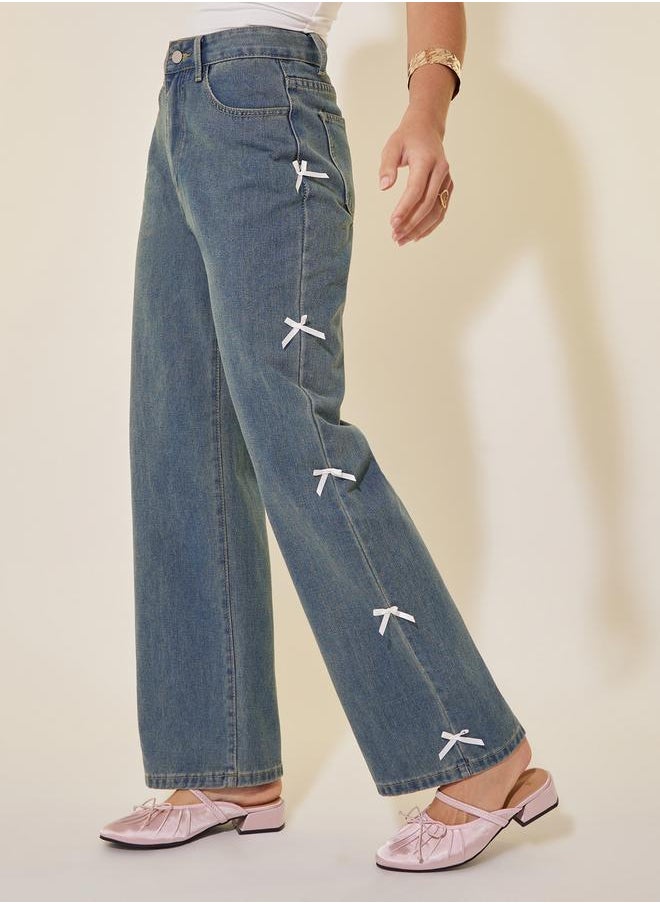 Mid Rise Wide Leg Faded Jeans with Bow Detail