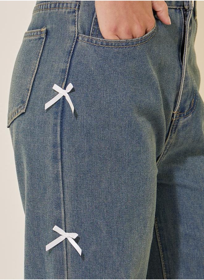 Mid Rise Wide Leg Faded Jeans with Bow Detail