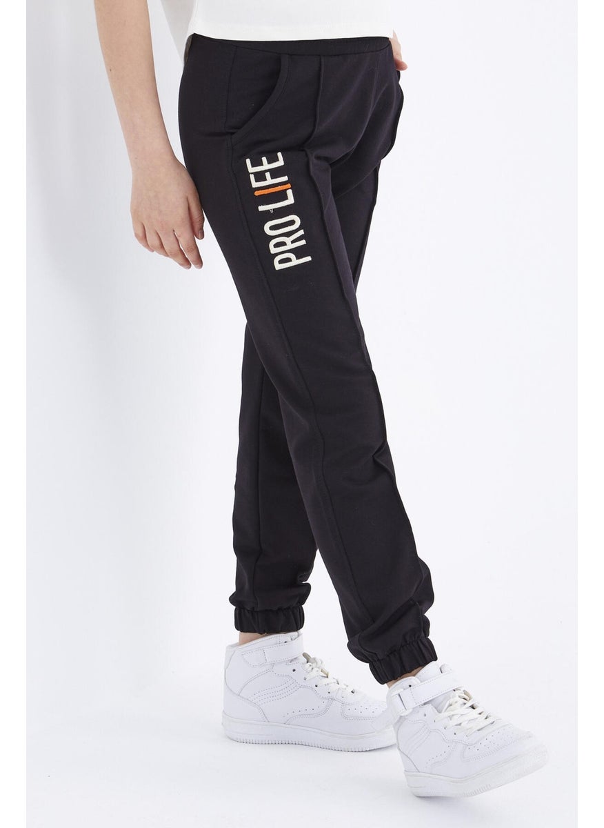 Black Letter Embroidered Lace-Up Standard Mold Elastic Leg Girls Tracksuit Bottom - 75050
