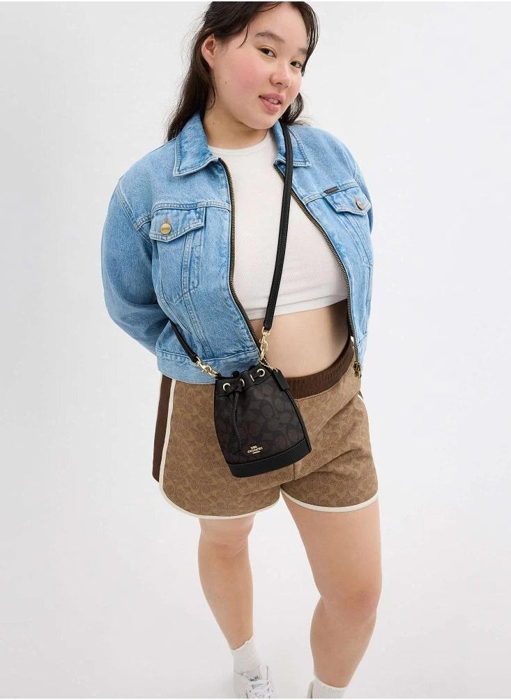 حقيبة دلو صغيرة من قماش Coach Signature