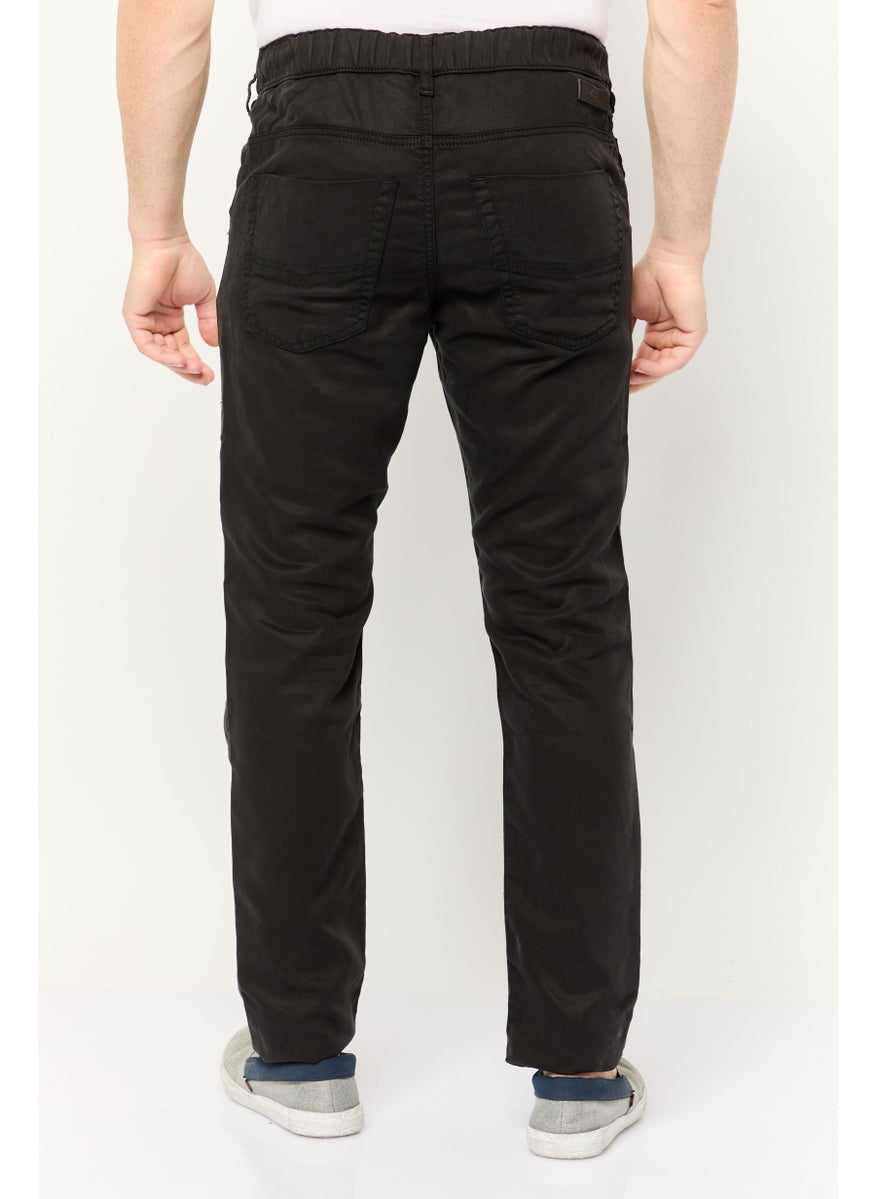 Men Tapered Fit Solid Stretchable Jeans, Black