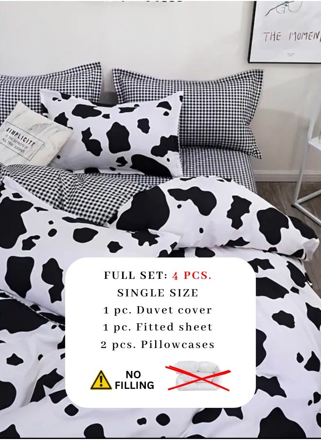 Single 4-piece reversible duvet cover set showcasing a charming black and white cow pattern.