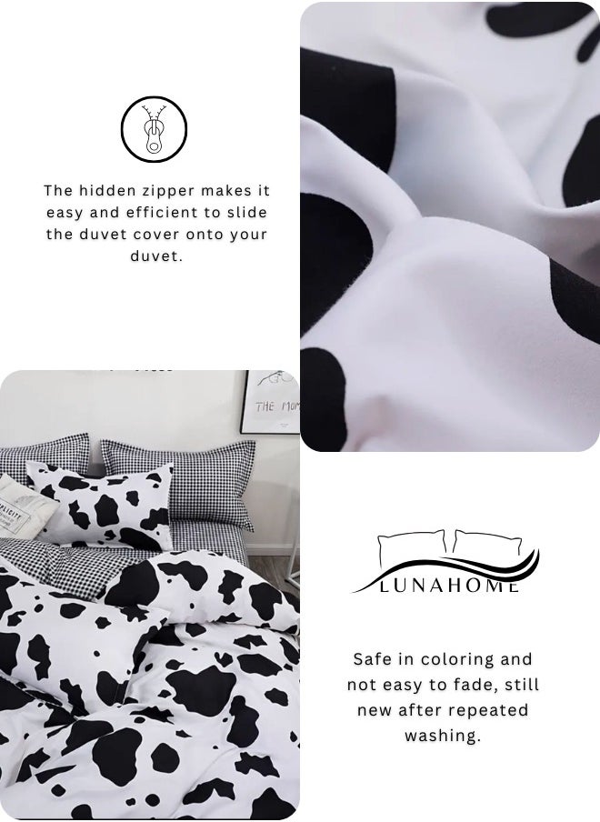 Single 4-piece reversible duvet cover set showcasing a charming black and white cow pattern.