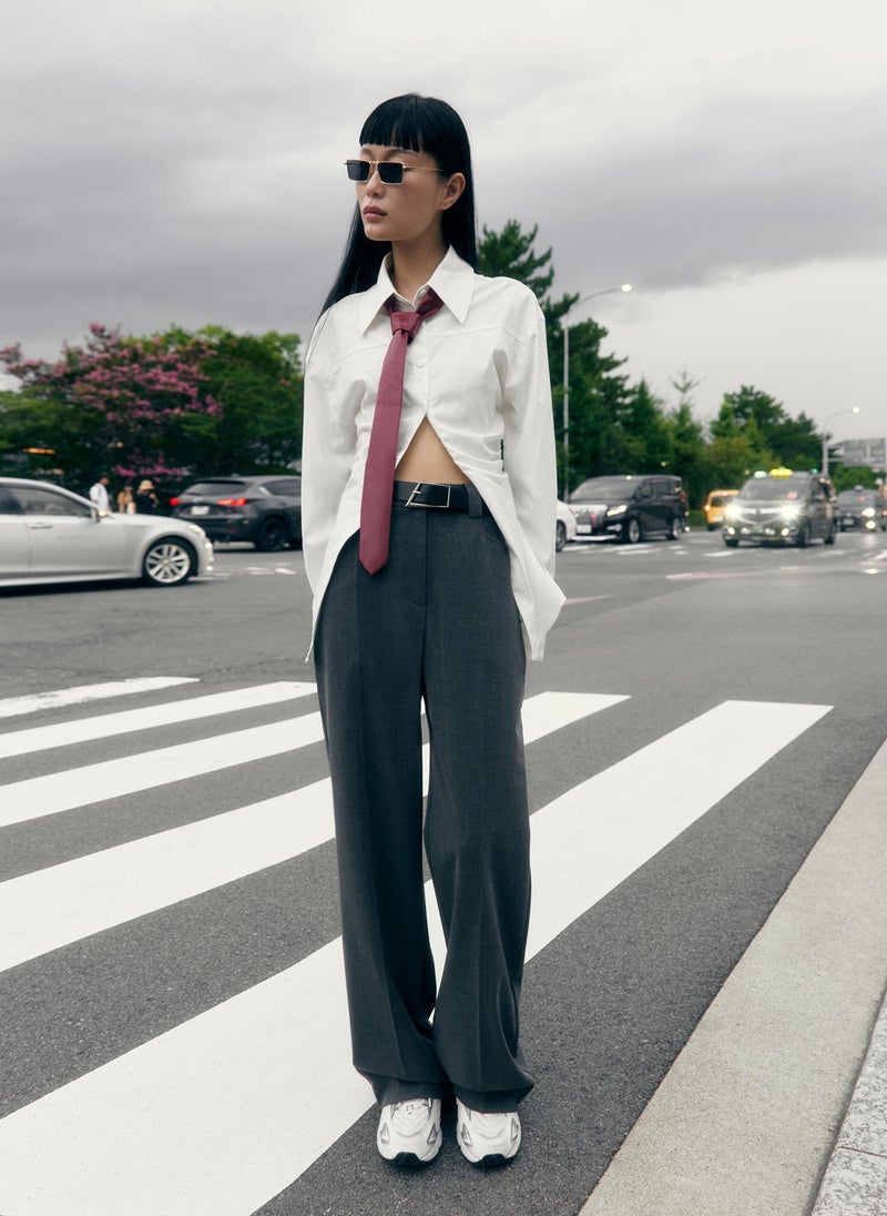Straight suiting trousers with stitched creases and a belt