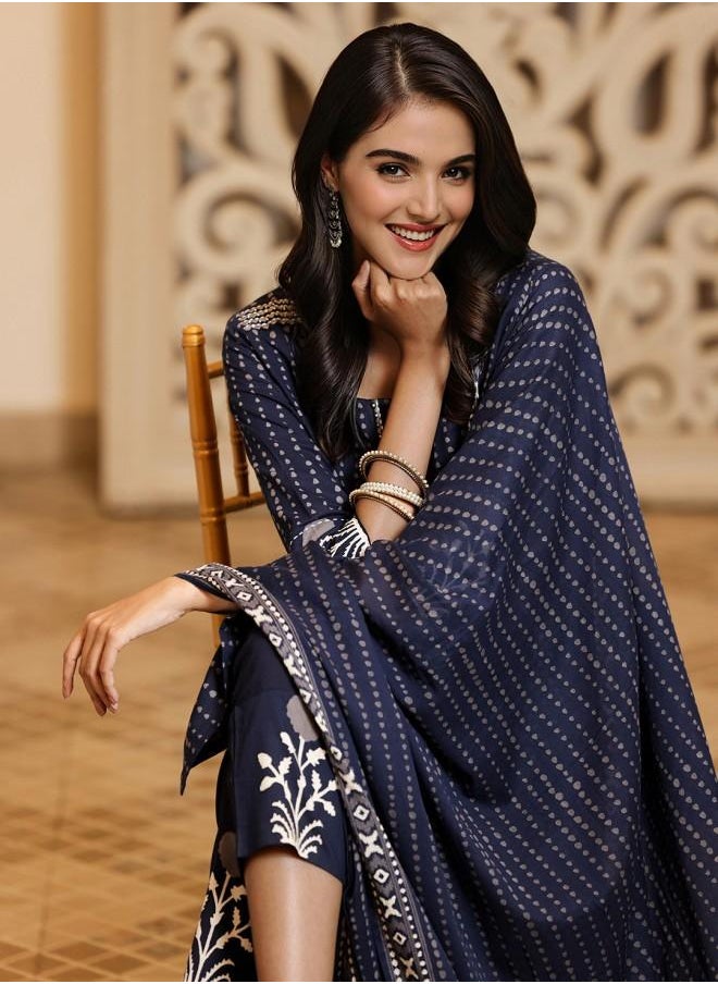 Elastic Women Navy Cotton Kurta Set with Embroidered pattern Tunic and Palazzo features a Round neckline and Three-Fourth Sleeve secured with Elastic closure and styled in Straight Fit ideal for Festive moments — exude elegance in every glance.