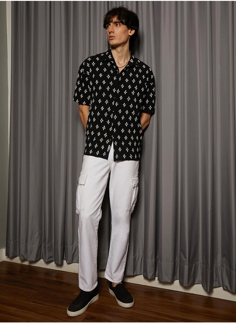 Campus Sutra Men's Midnight Black Floral-Tactile Oversized Shirt For Casual Wear | Spread Collar | Short Sleeve | Button Closure | Oversized Shirt Crafted With Comfort Fit For Everyday Wear