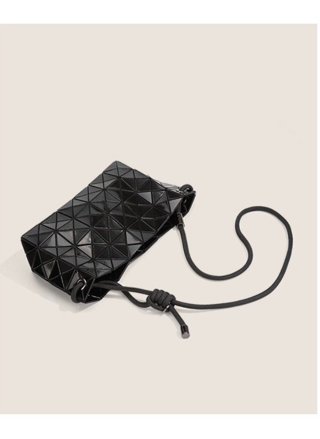 The new geometric diamond drawstring bag is stylish and simple, hanging on one shoulder in black.