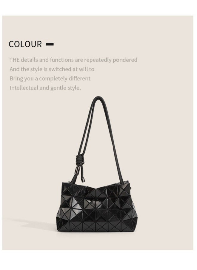 The new geometric diamond drawstring bag is stylish and simple, hanging on one shoulder in black.