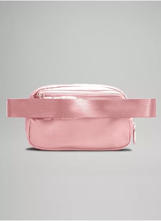 Everywhere Belt Bag, Compact, and Convenient Belly Bag with Zippered Pockets, Easy-Access Exterior Pocket, and Interior Essentials Pocket for On-the-Go Storage, Pink