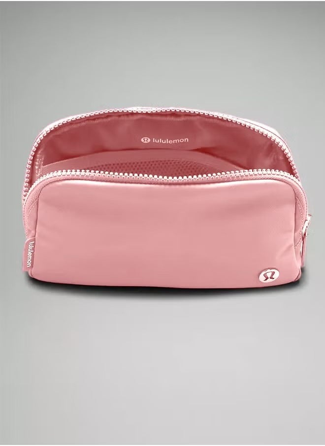 Everywhere Belt Bag, Compact, and Convenient Belly Bag with Zippered Pockets, Easy-Access Exterior Pocket, and Interior Essentials Pocket for On-the-Go Storage, Pink
